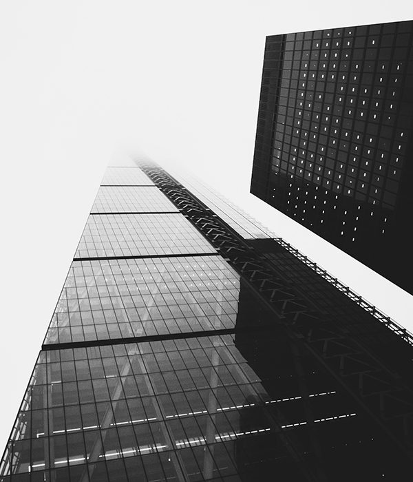 A black and white photo of the side of a building.