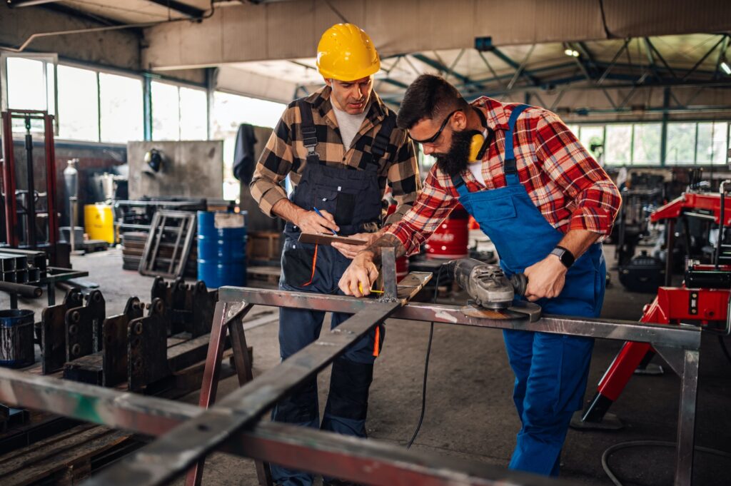 Two colleagues taking notes and measuring the product before grinding.